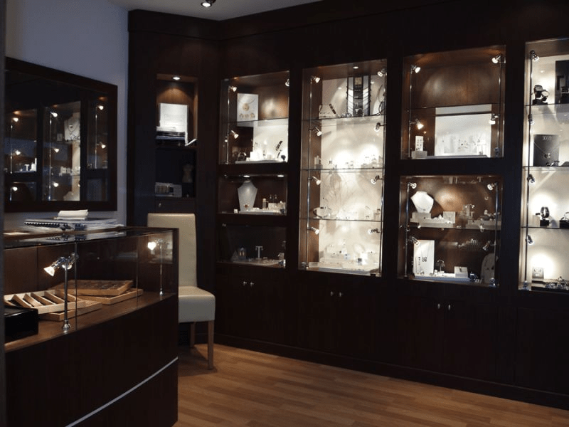 Museum display area with white cabinets